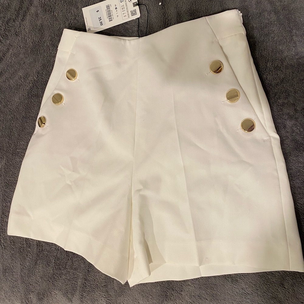 Brand new Zara white shorts with gold buttons. Great for casual or dressing up.